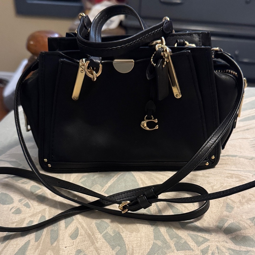 Coach. Black tiny Leather Handbag